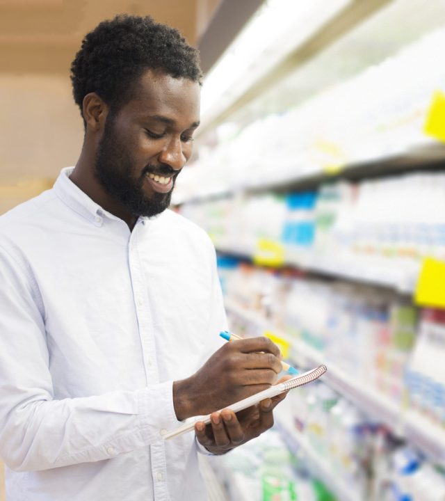 male-checking-off-items-grocery-list